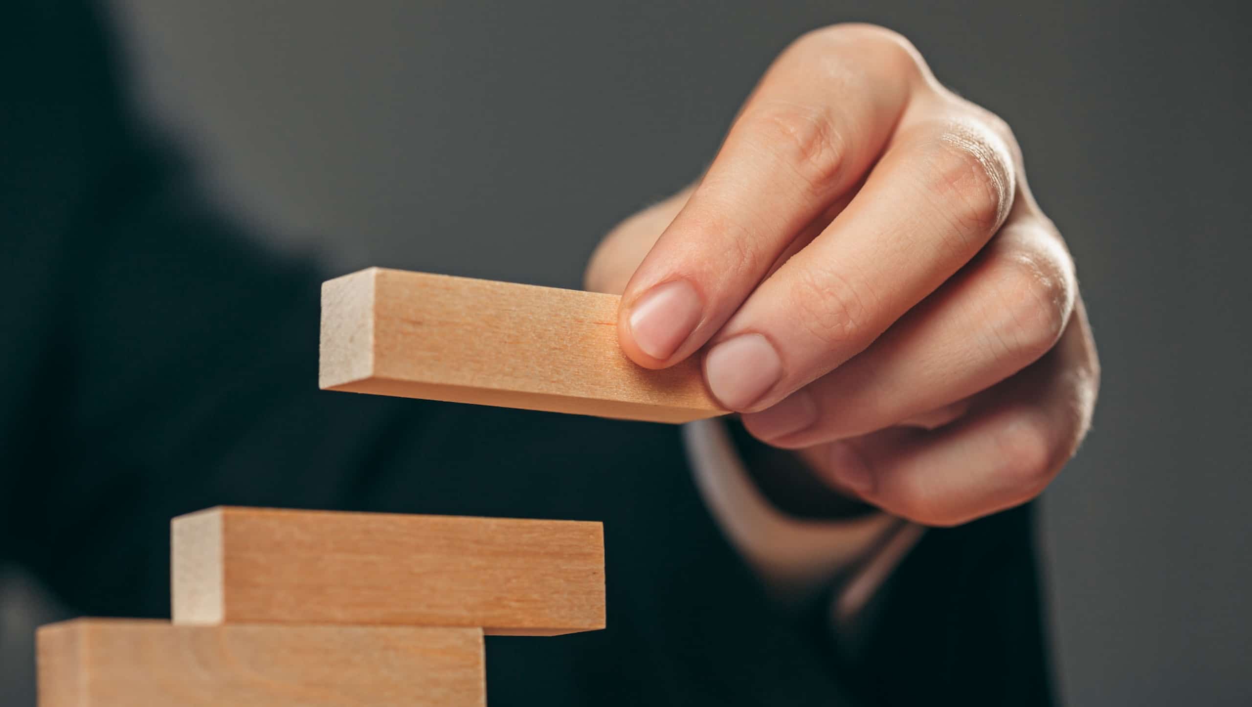 man-wooden-cubes-table-management-concept