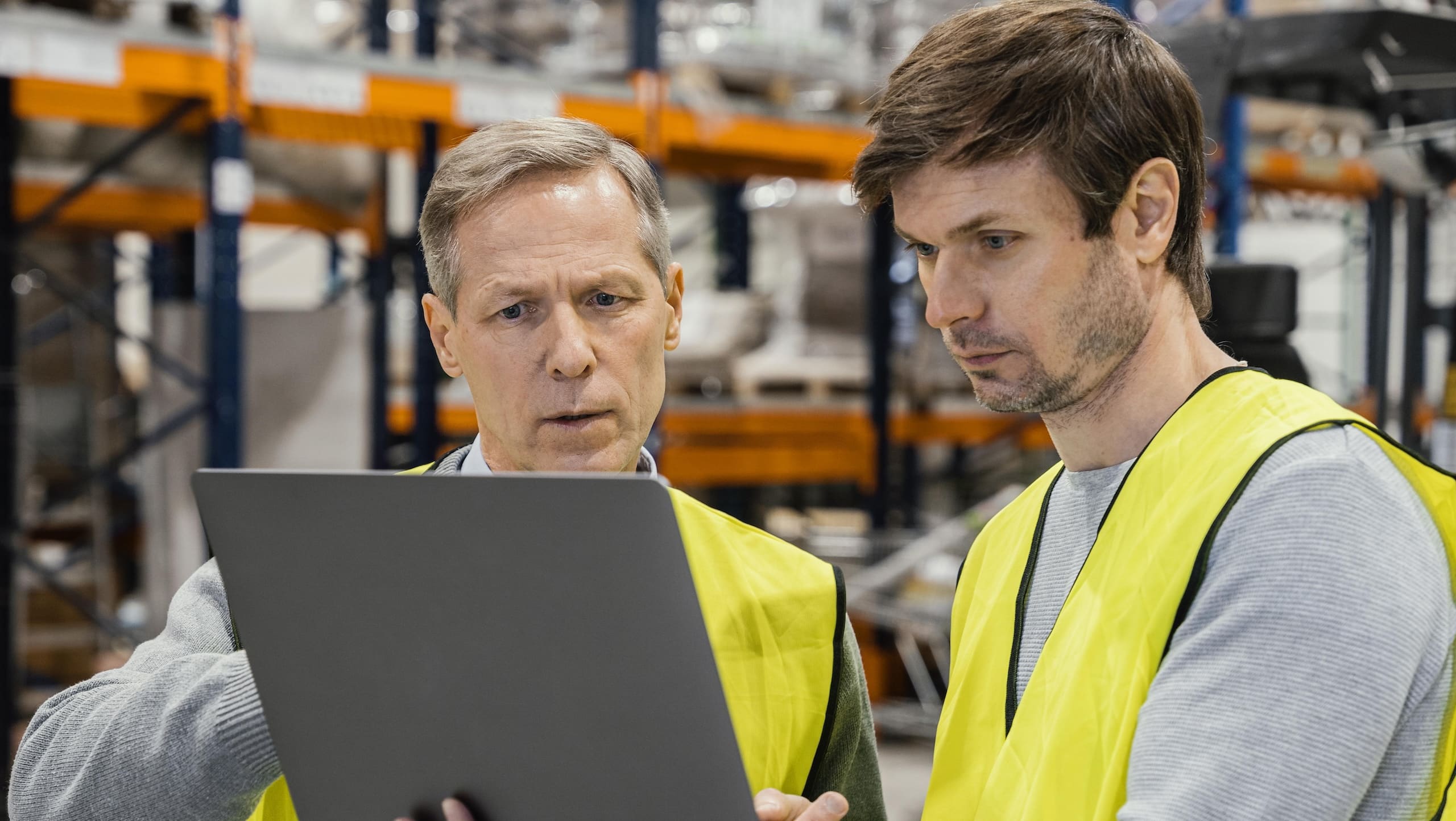 men-warehouse-working-laptop