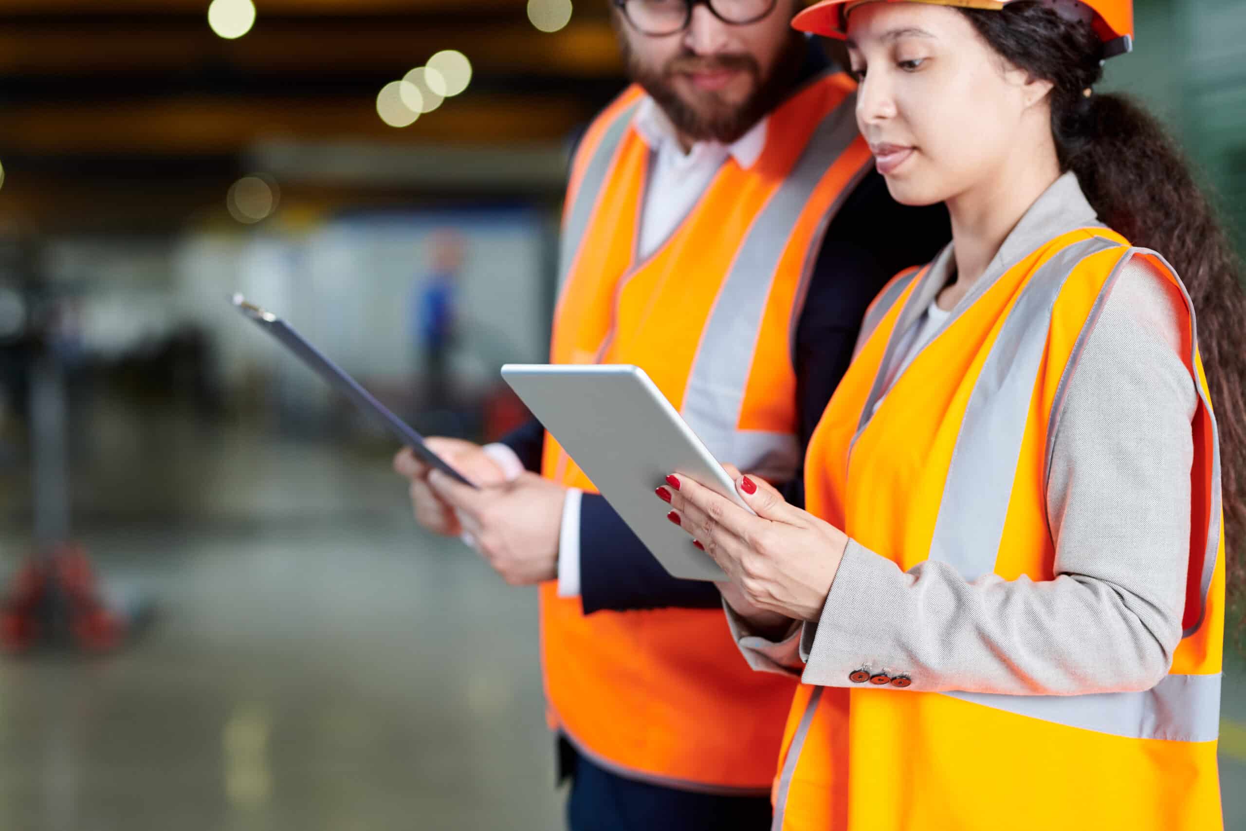 Factory Workers Using Digital Tablet