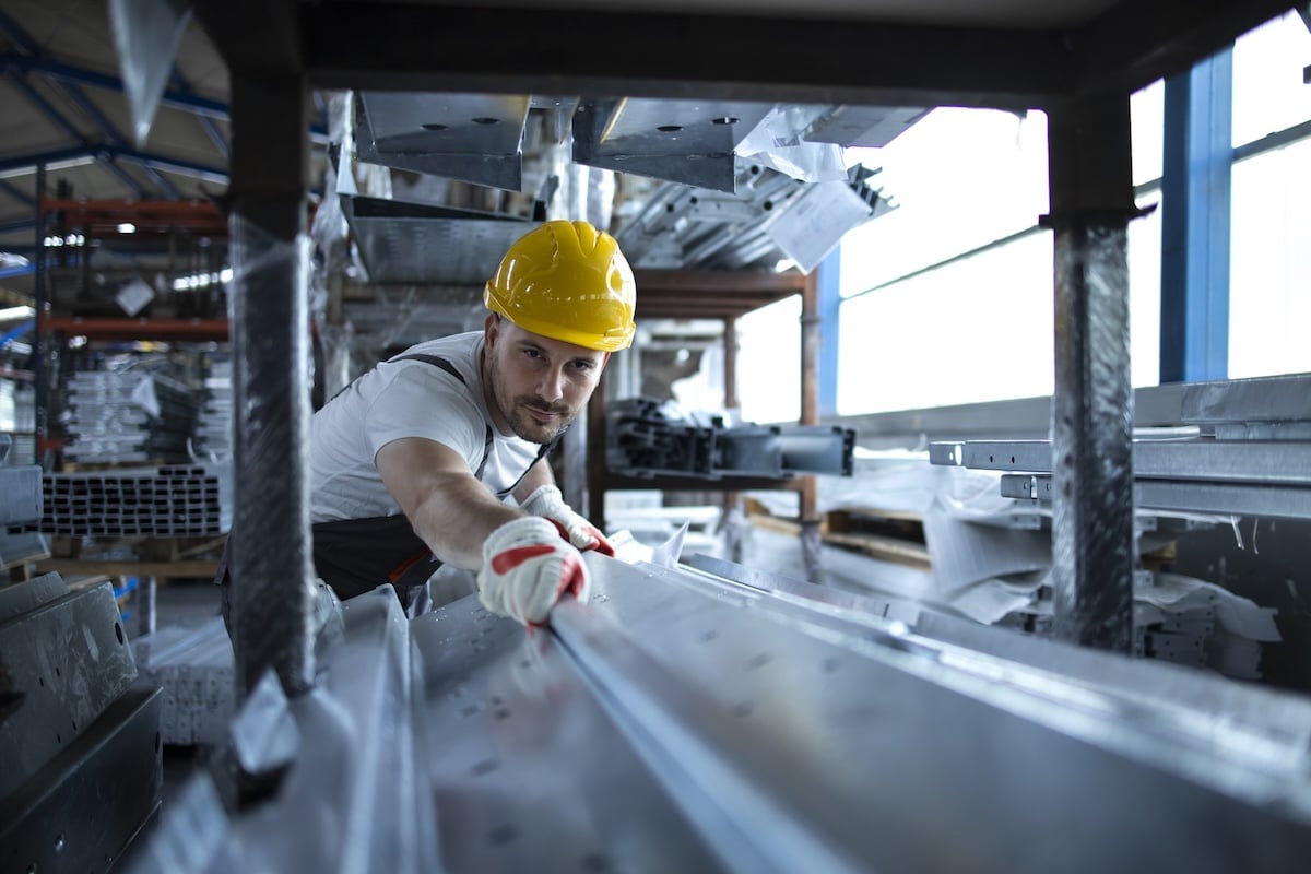 factory-worker-working-warehouse-handling-metal-material-production