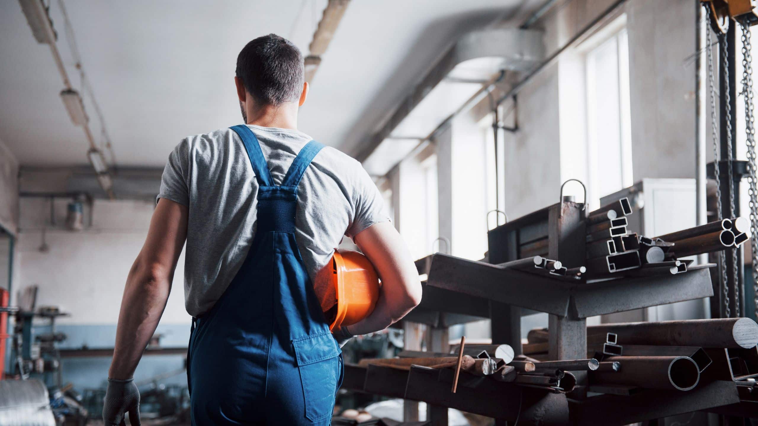portrait-young-worker-hard-hat-large-waste-recycling-factory